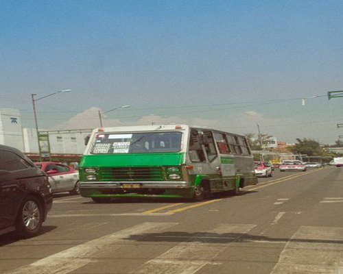 A wide view of the streets of Mexico City showing the flow of daily urban life